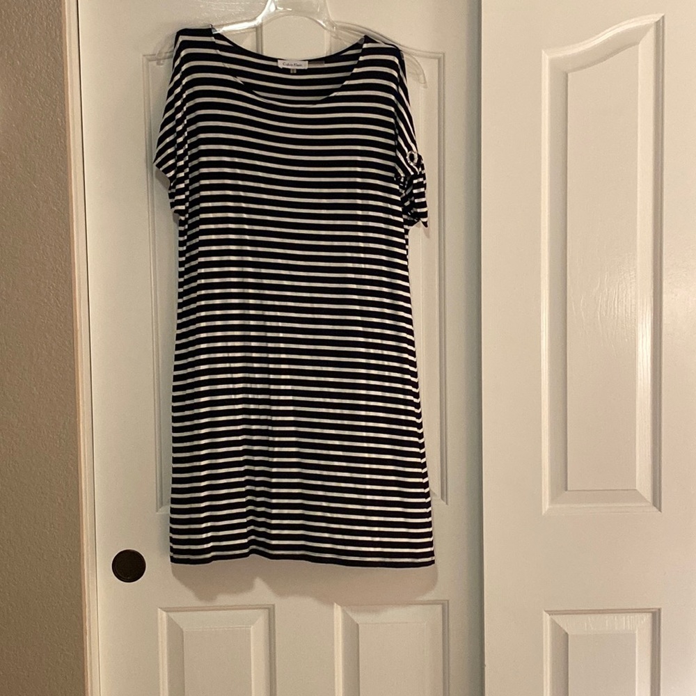 Calvin Klein black and white striped “ cold shoulder” dress on size M.